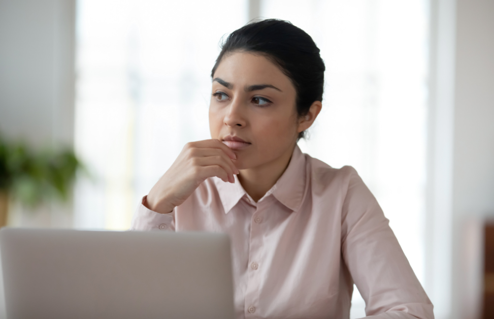 Thoughtful businesswoman considering her options for cloud consolidation